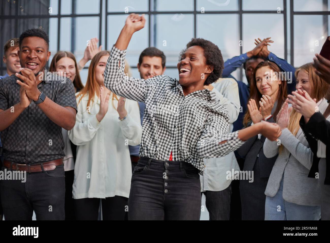 Business team celebrating a triumph with arms up Stock Photo - Alamy