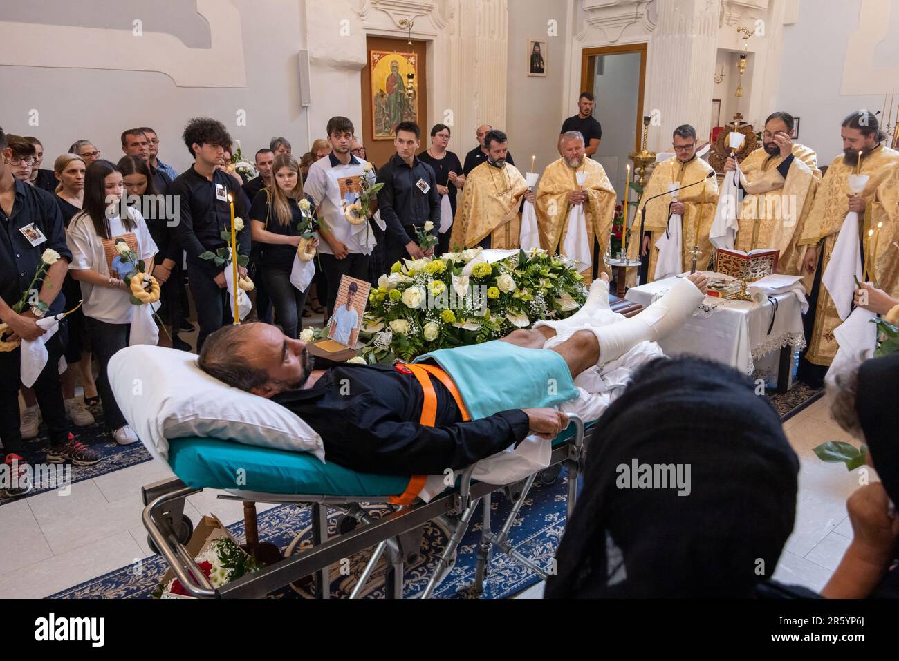 Fanel Pricopi, a 50-year-old man from Romania, attends the funeral of ...