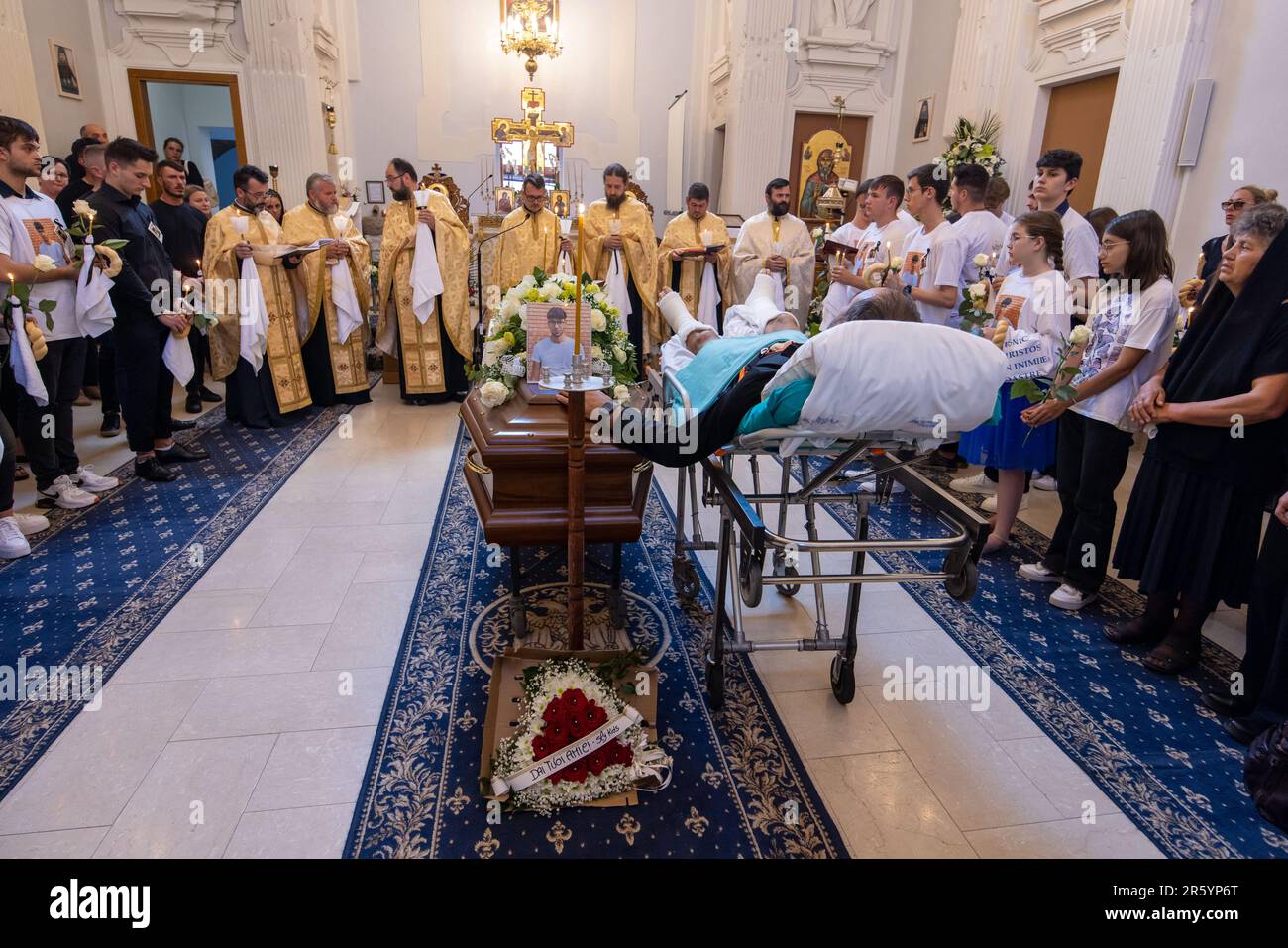 Fanel Pricopi, a 50-year-old man from Romania, attends the funeral of ...