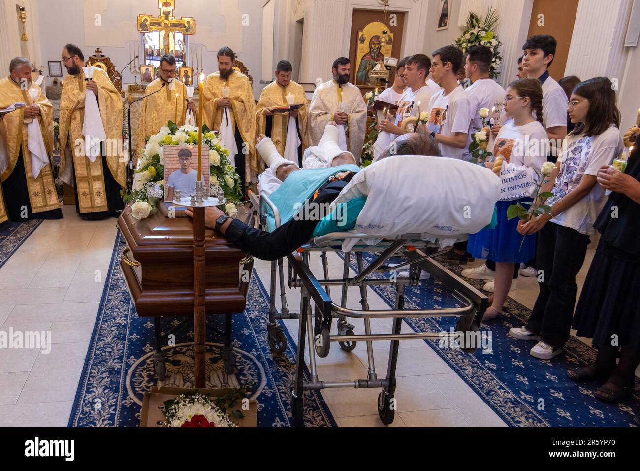 Fanel Pricopi, a 50-year-old man from Romania, attends the funeral of ...
