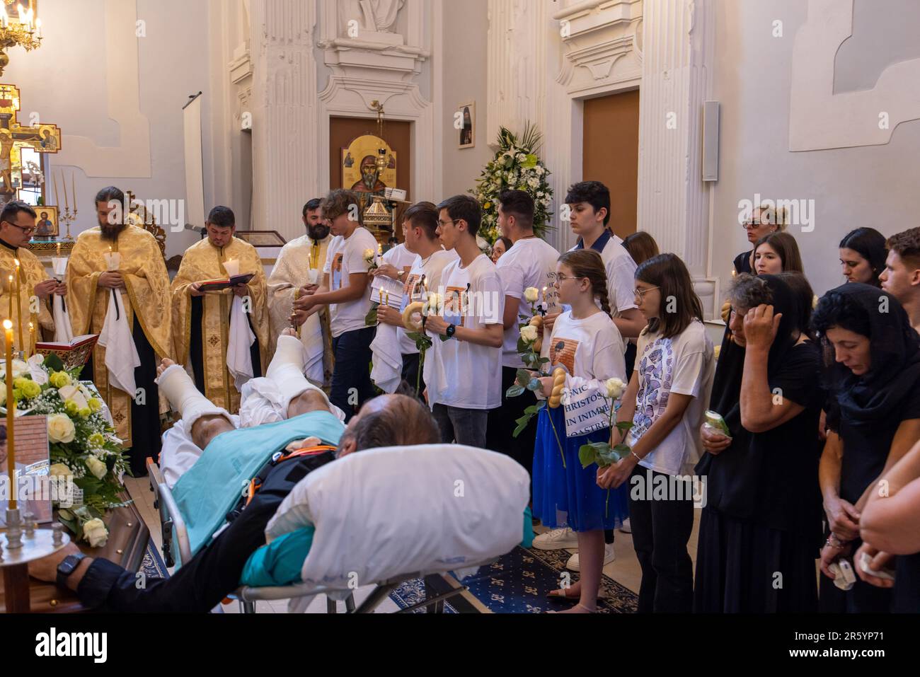 Fanel Pricopi, a 50-year-old man from Romania, attends the funeral of ...