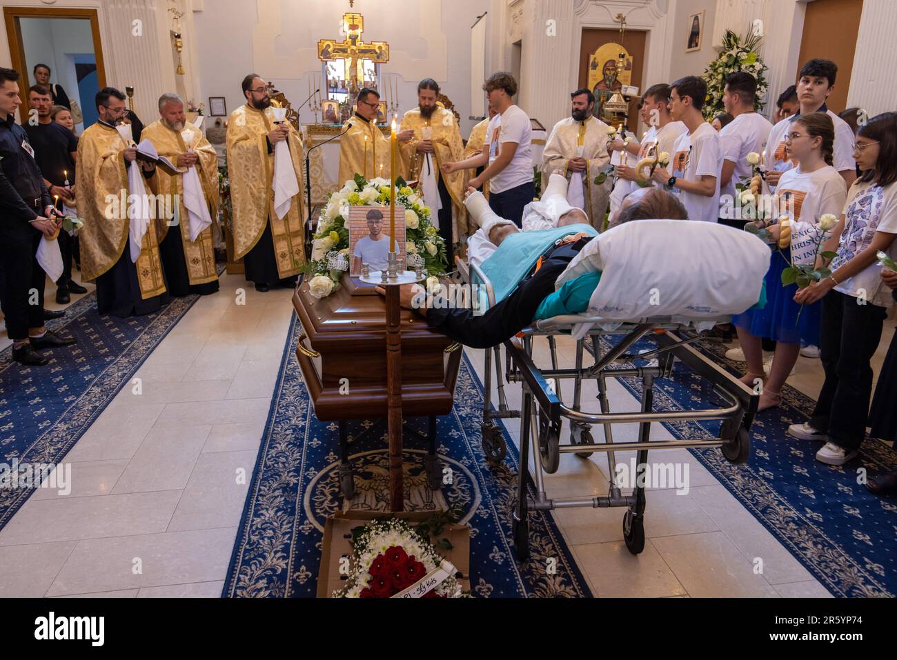 Fanel Pricopi, a 50-year-old man from Romania, attends the funeral of ...