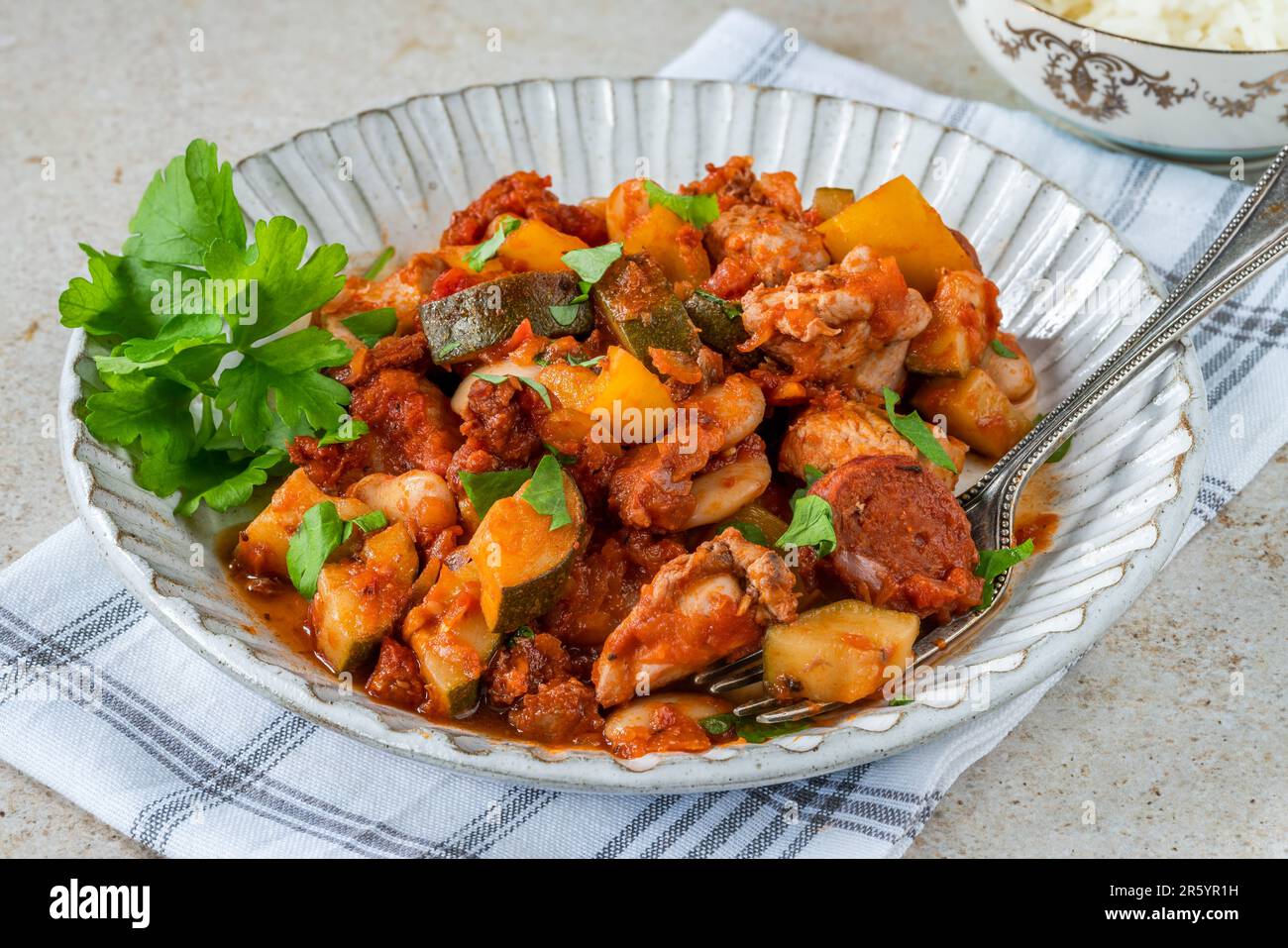 Spanish chicken stew with red wine, chorizo and vegetables Stock Photo
