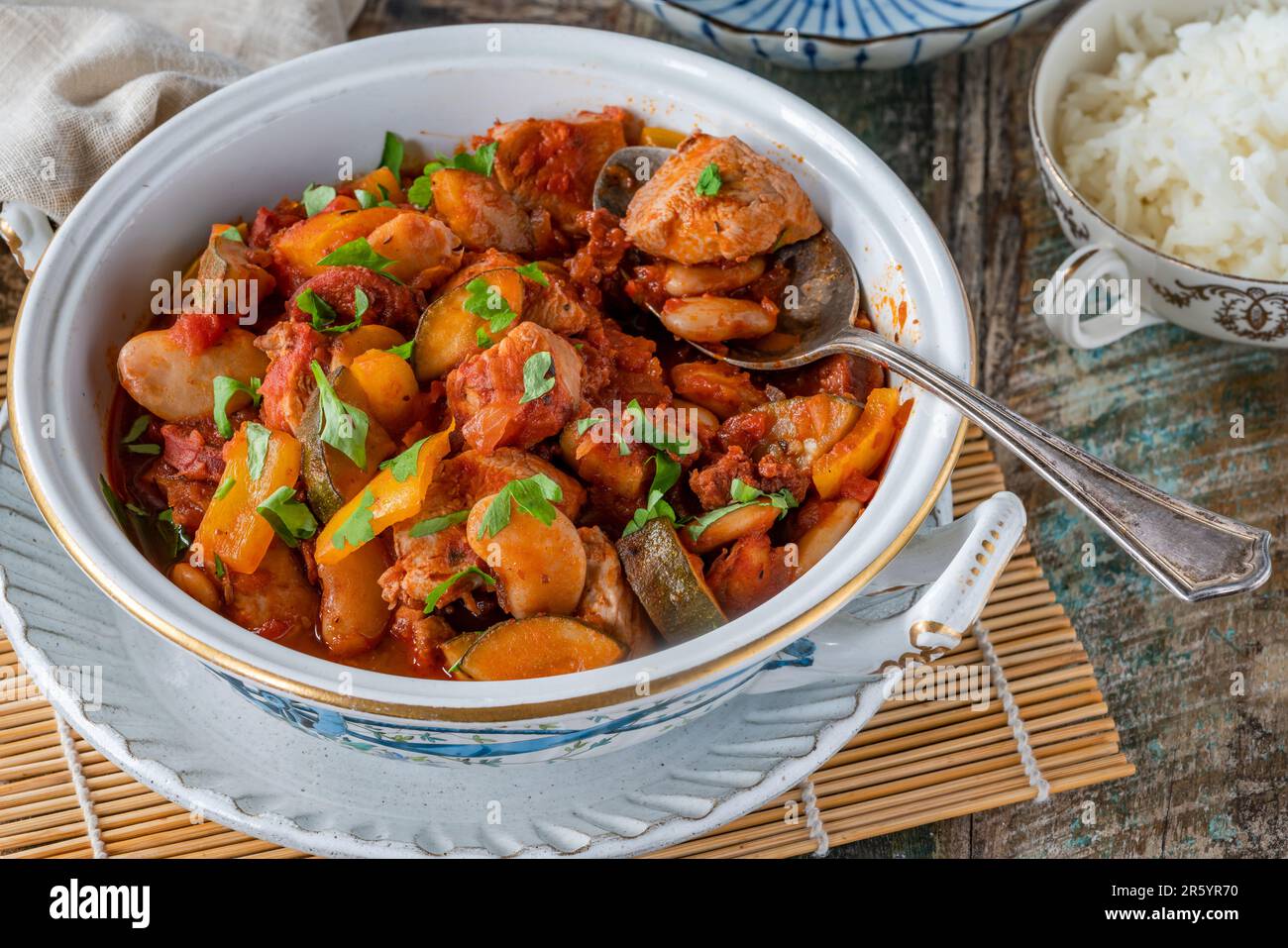 Spanish chicken stew with red wine, chorizo and vegetables Stock Photo