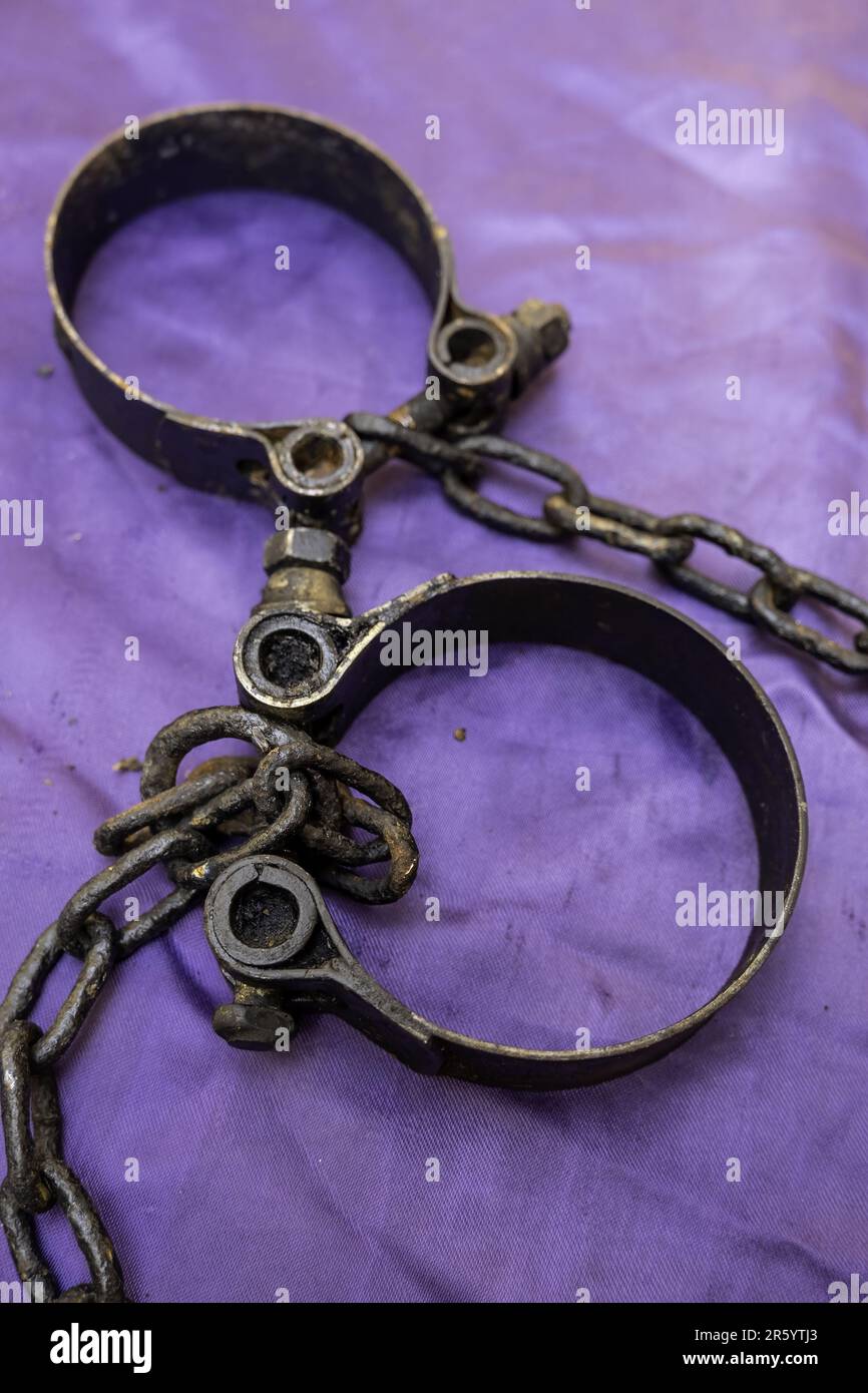 Iron handcuffs with chains, medieval torture, inquisition Stock Photo Alamy