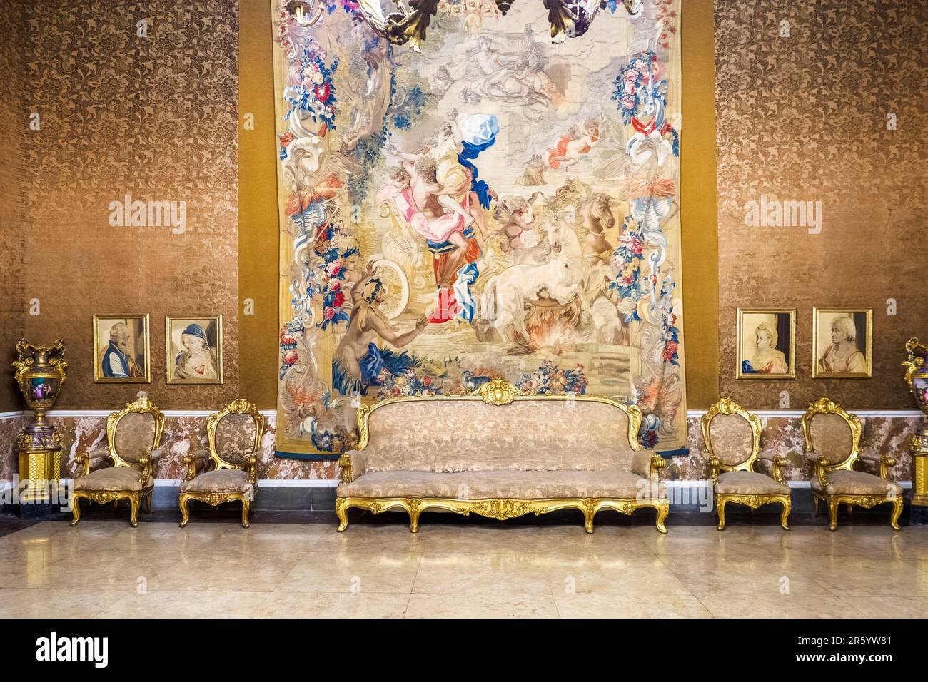 Neo-Rococo style furniture and the 18th century Neapolitan-manufactured tapestries in the third Antechamber in the Royal Palace of Naples that In 1734 became the royal residence of the Bourbons - Naples, Italy Stock Photo