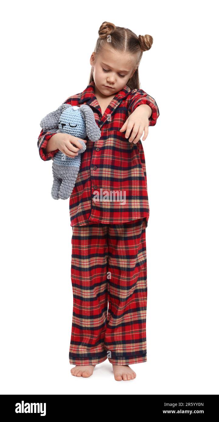 Girl in pajamas with toy bunny sleepwalking on white background Stock ...