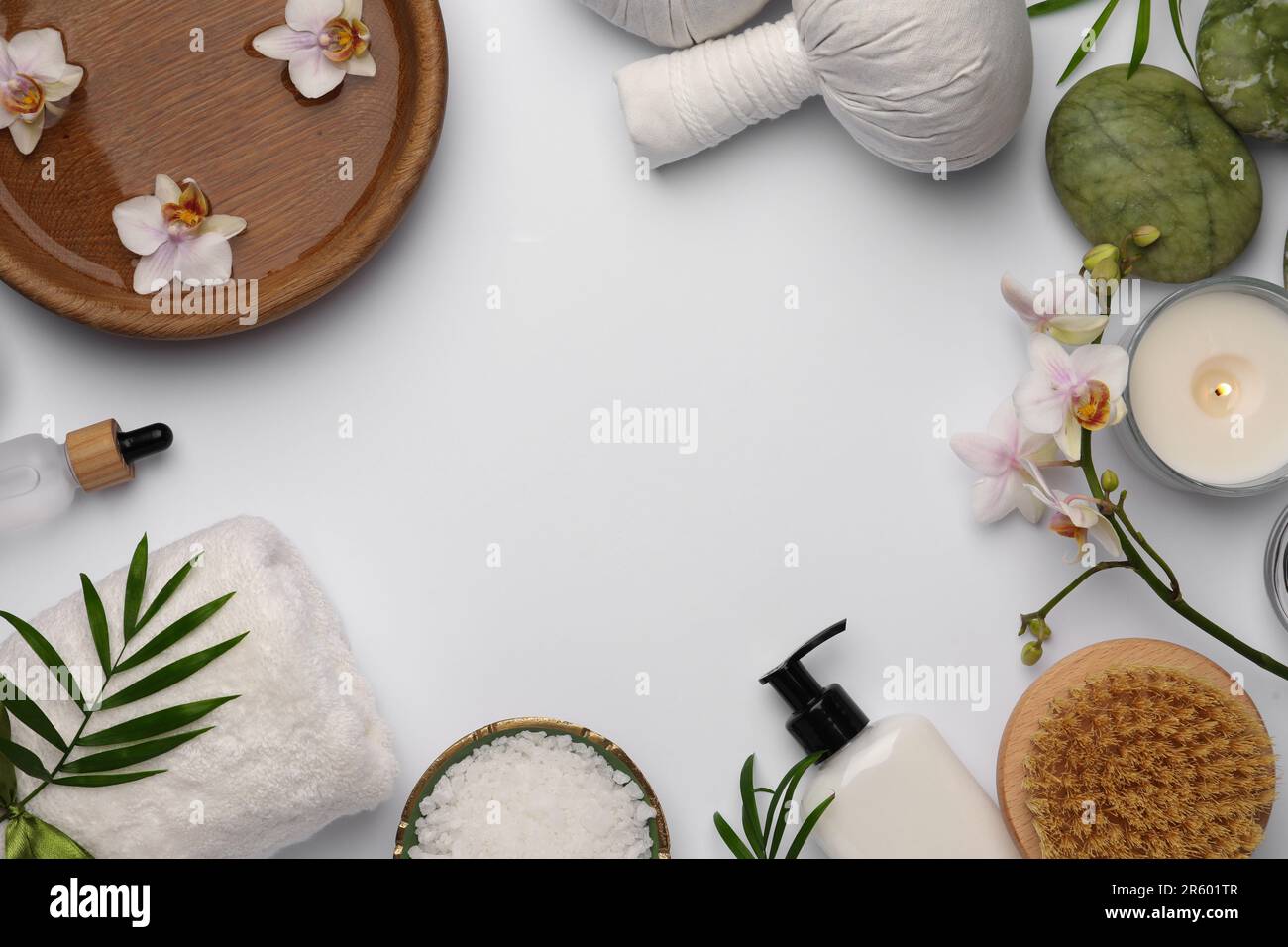 Flat lay composition with different spa products on white background ...