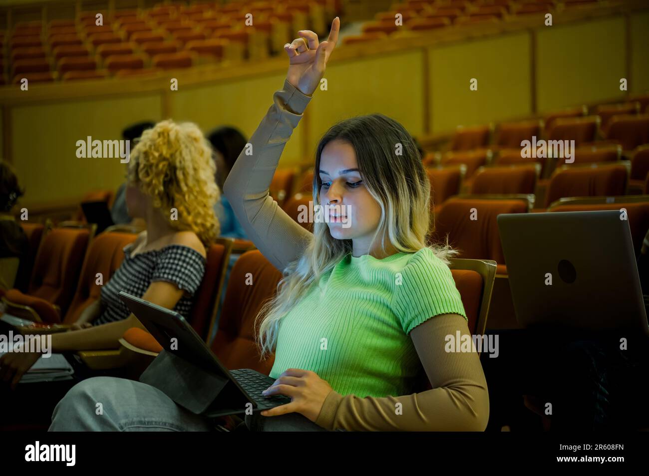 Woman raising hand hi-res stock photography and images - Alamy