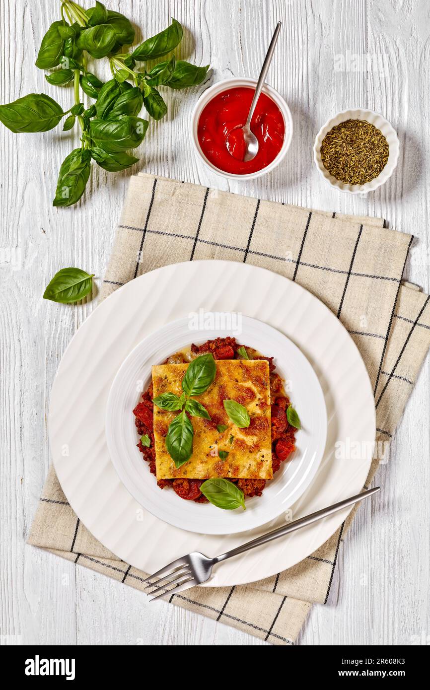 portion of upside down pizza of chorizo sausages, tomato sauce