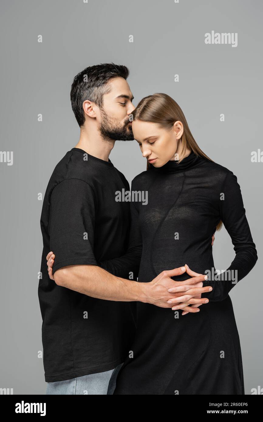 Pregnant woman kissing husband isolated hi-res stock photography and images 