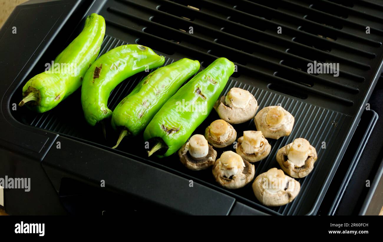 Smokeless barbecue cooking at home close up view Stock Photo