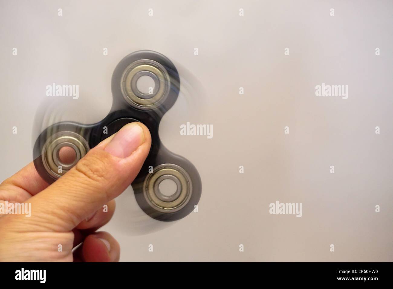 Rotating fidget spinner hi-res stock photography and images - Alamy
