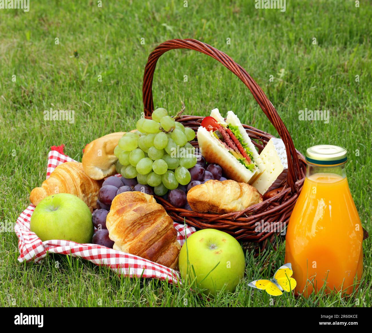 basket with fruits and picnic food on green lawn Stock Photo - Alamy