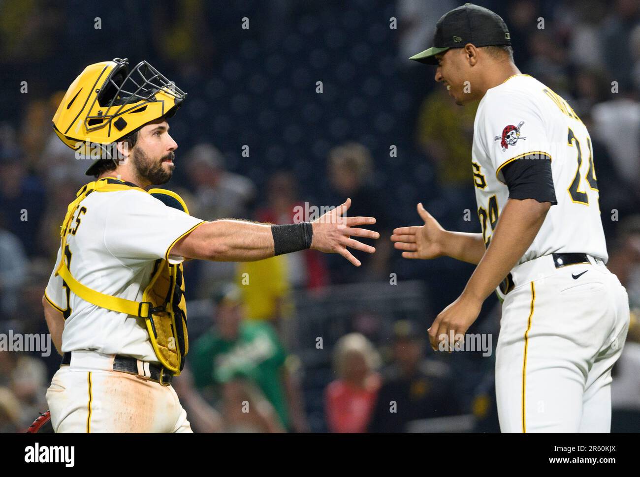 Pittsburgh Pirates catcher Austin Hedges (18) (l) greets Pittsburgh Pirates  starting pitcher Johan Oviedo (24) following the 5-4 win against the  Oakland Athletics at PNC Park on Monday June 5, 2023 in