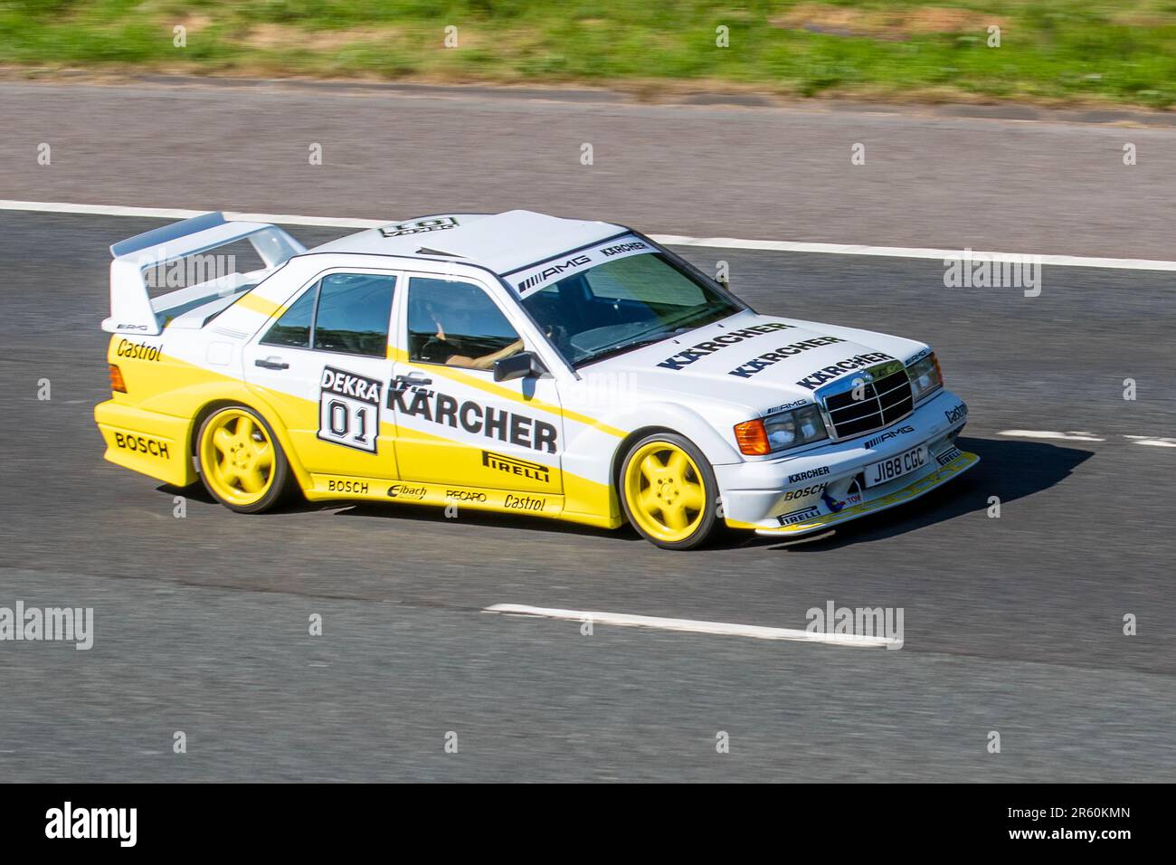 1991 90s nineties Yellow White Mercedes 190E, Saloon Petrol 1797 cc Decra 01 KARCHER sponsored modified motorsports vehicle with rear spoiler, decals & stickers Stock Photo