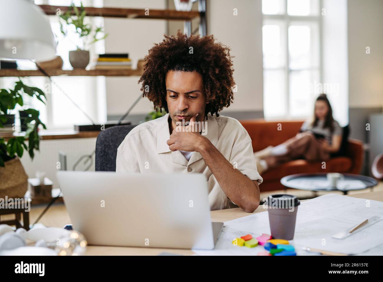 Young colleagues working in a photo atelier. Stock Photo