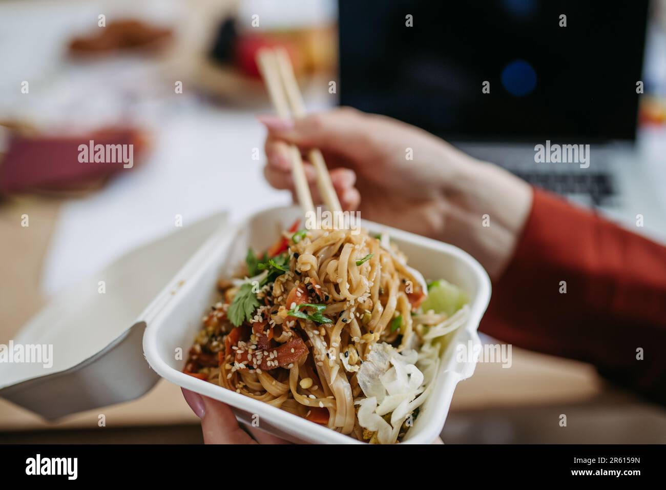 Close up of chinese food, lunch time in an office. Stock Photo