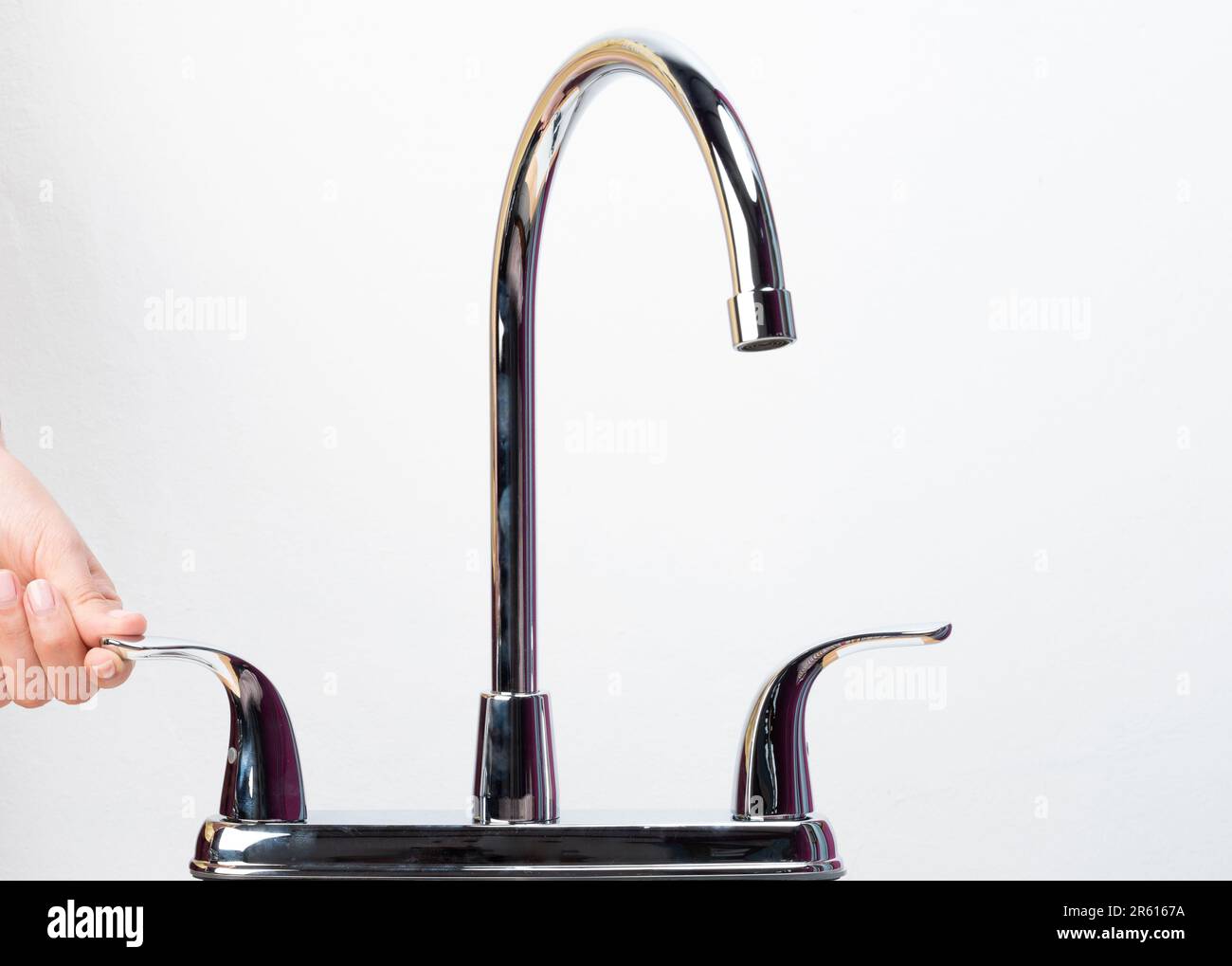 Save water resources theme. Stainless mixer faucet  on white isolated background Stock Photo