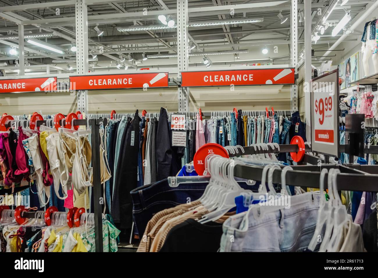 clearance section of a clothing store Stock Photo - Alamy