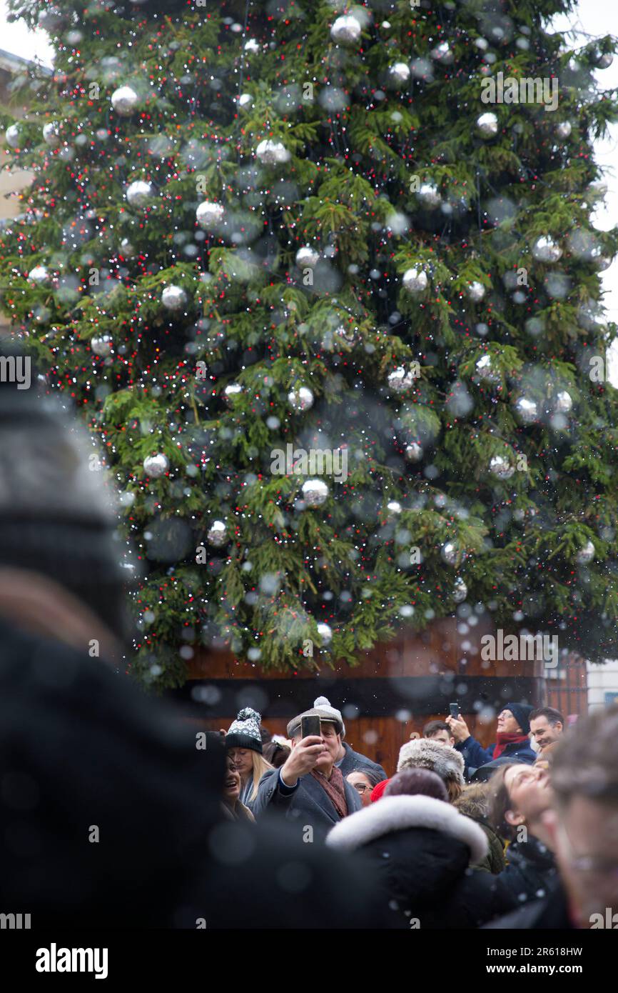 Christmassy decorations and artificial snow flakes are seen in Covent