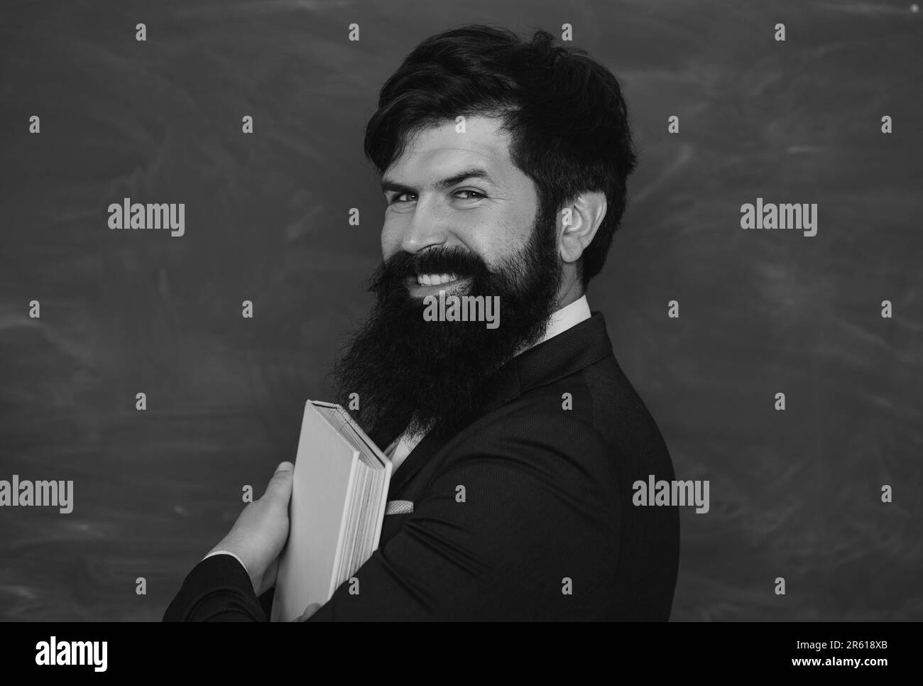 Student preparing for test or exam. Teachers day. Young bearded teacher ...