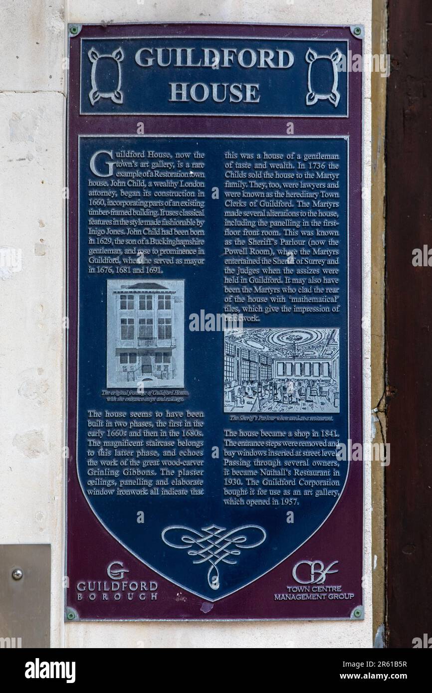 Surrey, UK - April 7th 2023: Close-up of a plaque on the exterior of Guildford House, detailing the history of the building, in the town of Guildford Stock Photo
