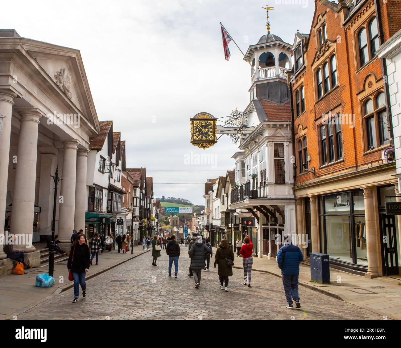 Surrey, UK - April 5th 2023: View of the High Street, in the historic town of Guildford in Surrey, UK.  Guildford Guildhall and clock, and Tunsgate ca Stock Photo