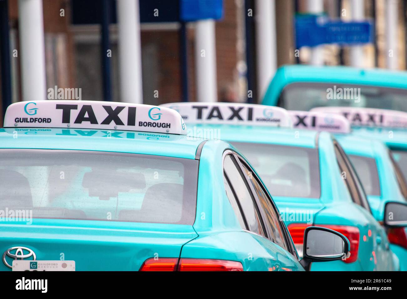 Surrey, UK - April 5th 2023: A line of Taxis, outside Guildford Railway Station in Surrey, UK. Stock Photo