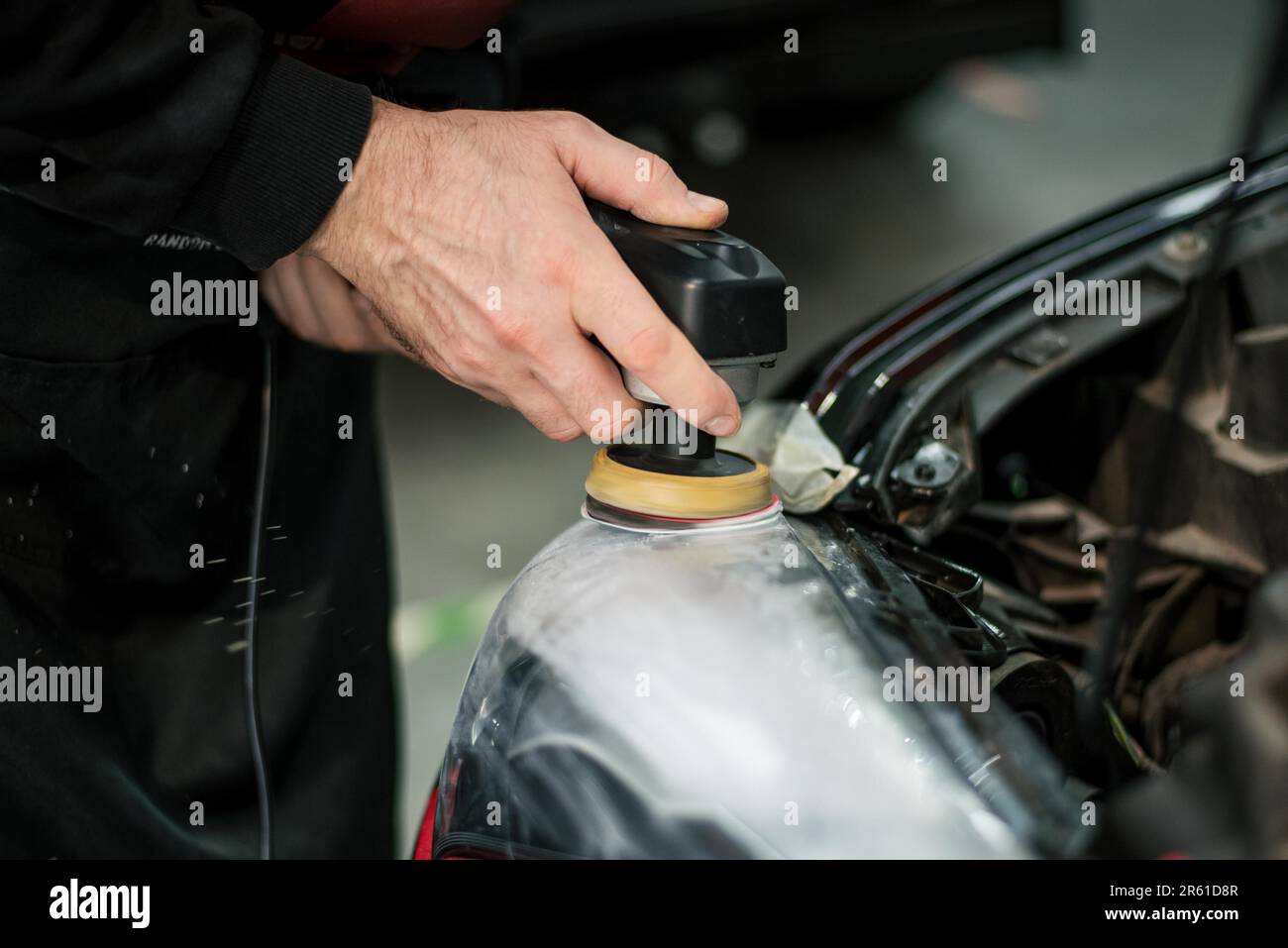 Meguiar's Quik Detailer, polish and polishing cloths on the boot of a black  car as the owner polishes it Stock Photo - Alamy