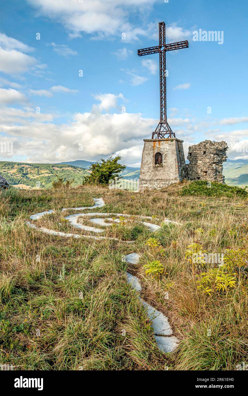 Cross on top of the Roccione of Pennabilli in Emilia Romagna, North Italy Stock Photo