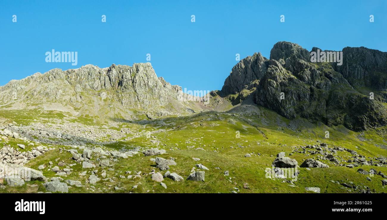 Scafell Pike, left, Mickledore, centre, Scafell (Sca fell), right, taken from Hollow Stones route. Southern Fells, Lake District, England, UK Stock Photo