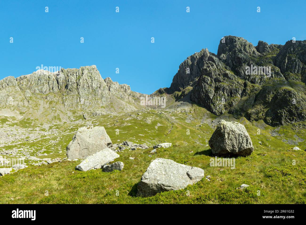 Scafell Pike, left, Mickledore, centre, Scafell (Sca fell), right, taken from Hollow Stones route. Southern Fells, Lake District, England, UK Stock Photo