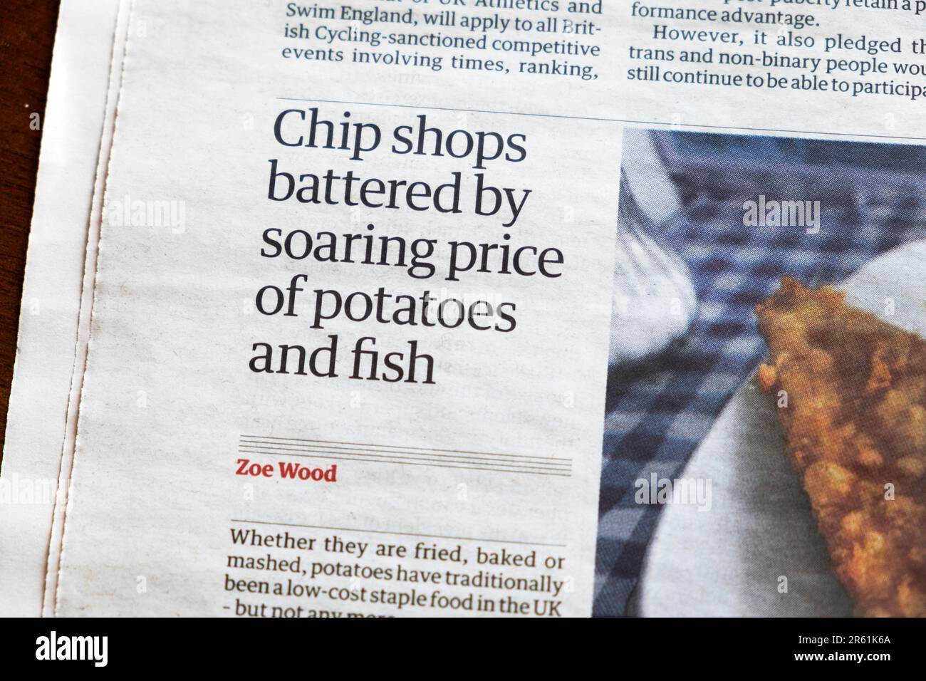 'Chip shops battered by soaring price of potatoes and fish' Guardian newspaper headline cost of living eating food article 27 May 2023 London UK Stock Photo