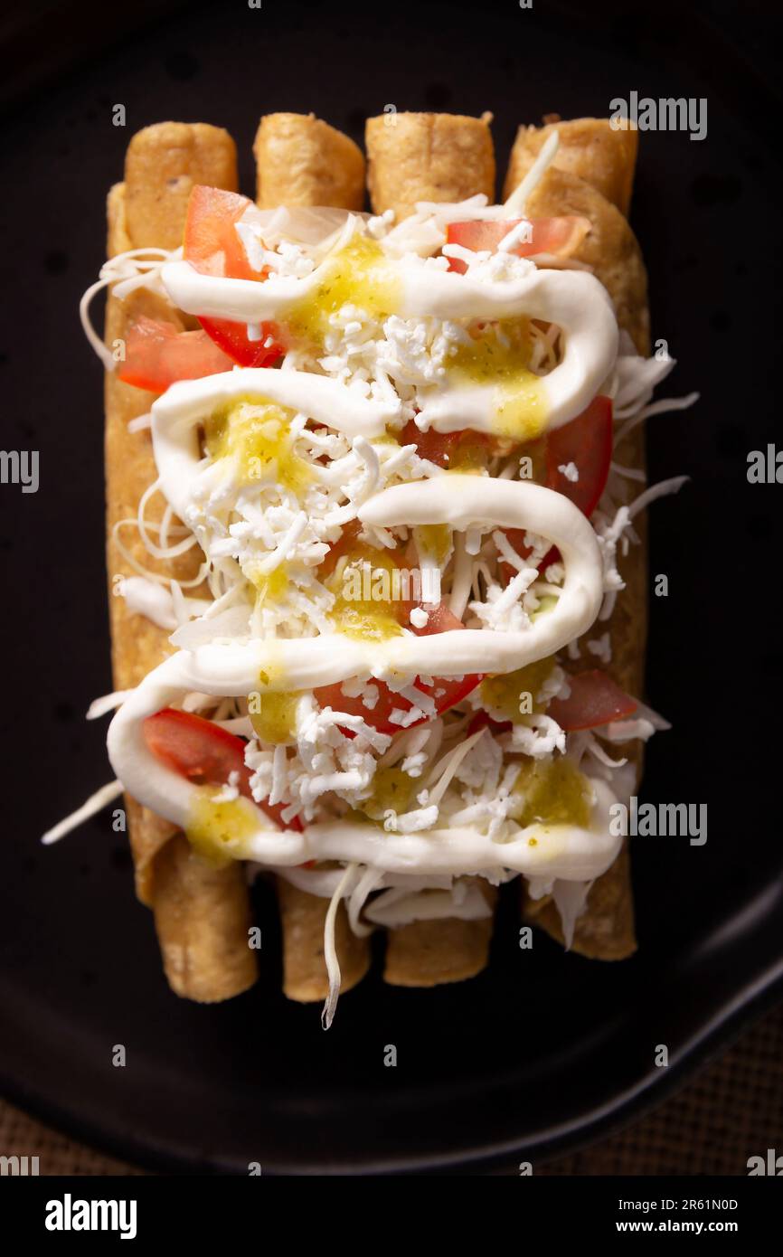 Tacos Dorados. Mexican dish also known as Flautas, consists of a rolled