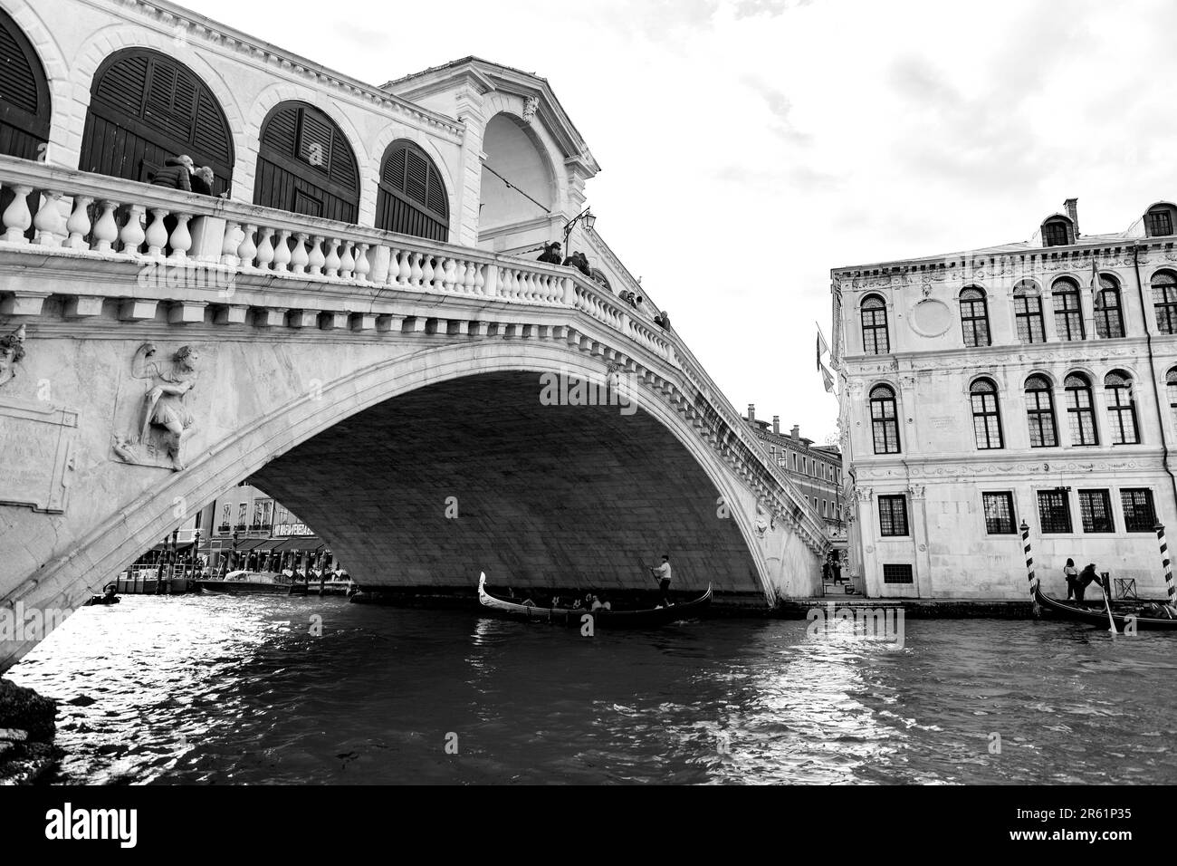 Venice, Italy - April 2, 2022: The famous Rialto Bridge over the Grand Canal in Venice, Veneto, Italy. Stock Photo