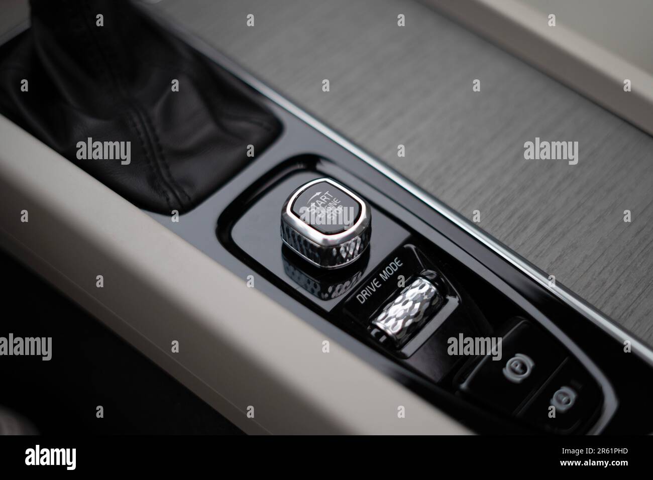An interior shot of a luxury sedan Volvo car with a startstop button