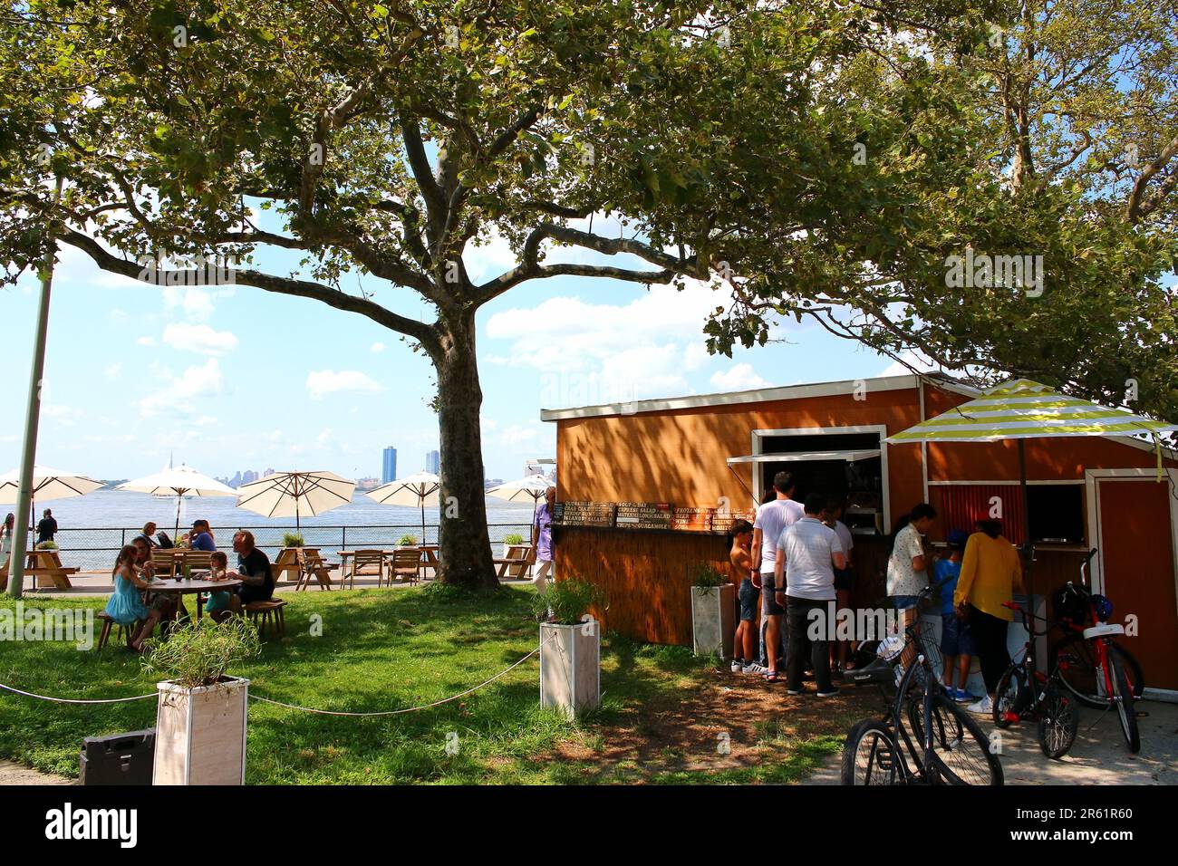 Visitors enjoy concessions from Sea Biscuit food stand on Governors Island, on August 4th, 2019 in Manhattan, New York, USA. (Photo by Wojciech Migda) Stock Photo