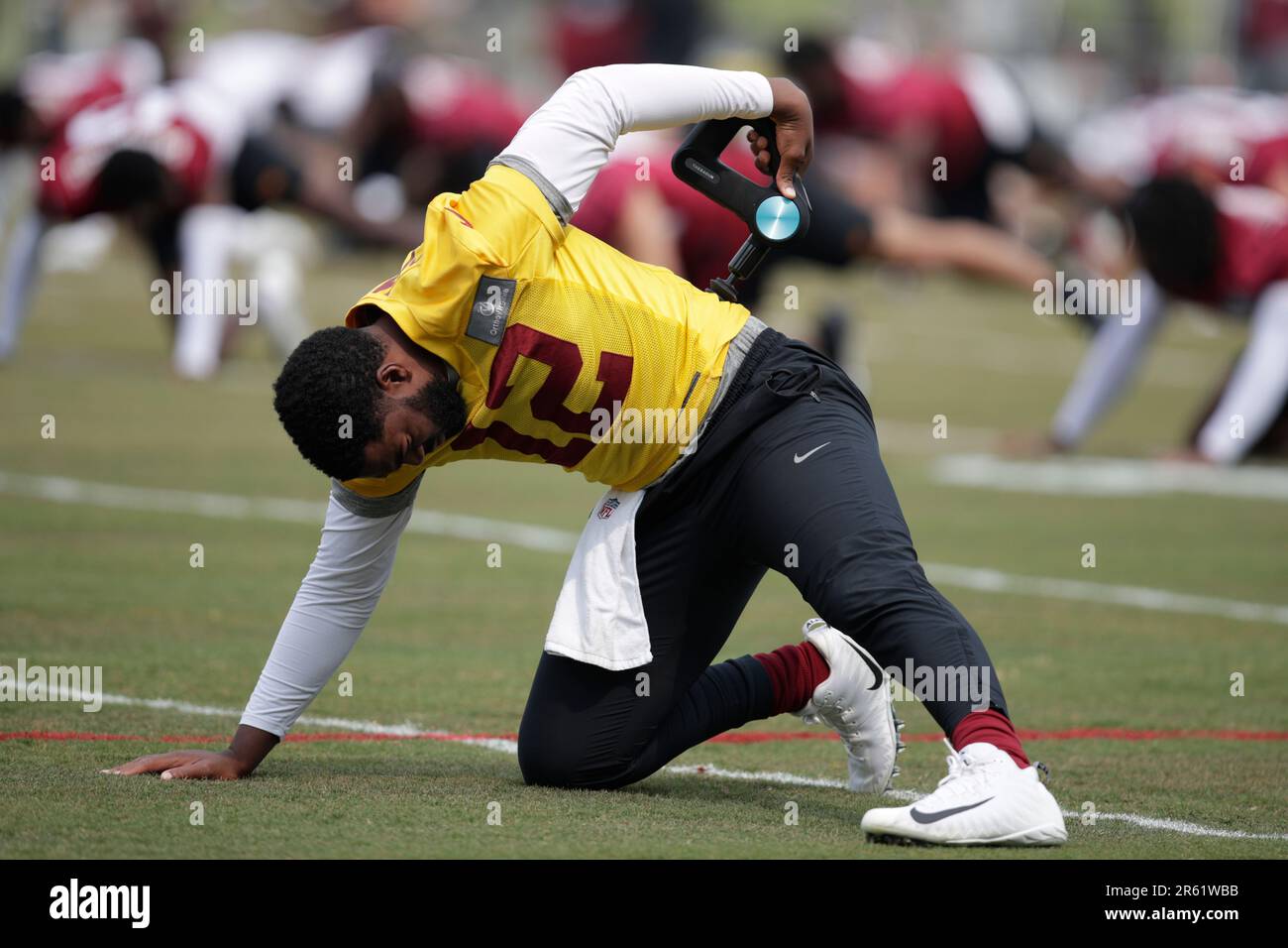 Washington Commanders quarterback Jacoby Brissett uses a message gun ...