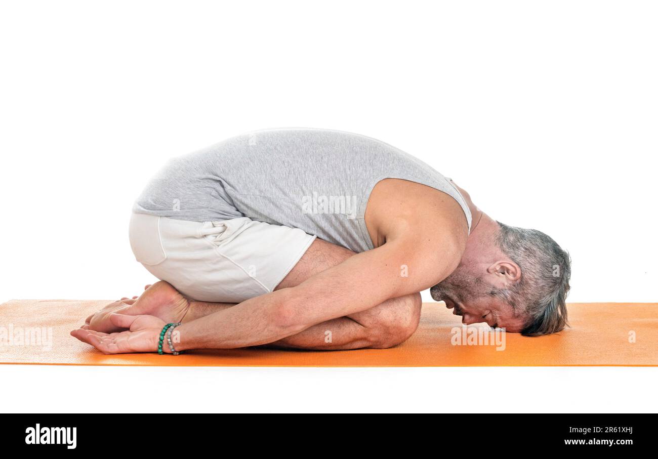 man and hatha yoga asana in front of white background Stock Photo