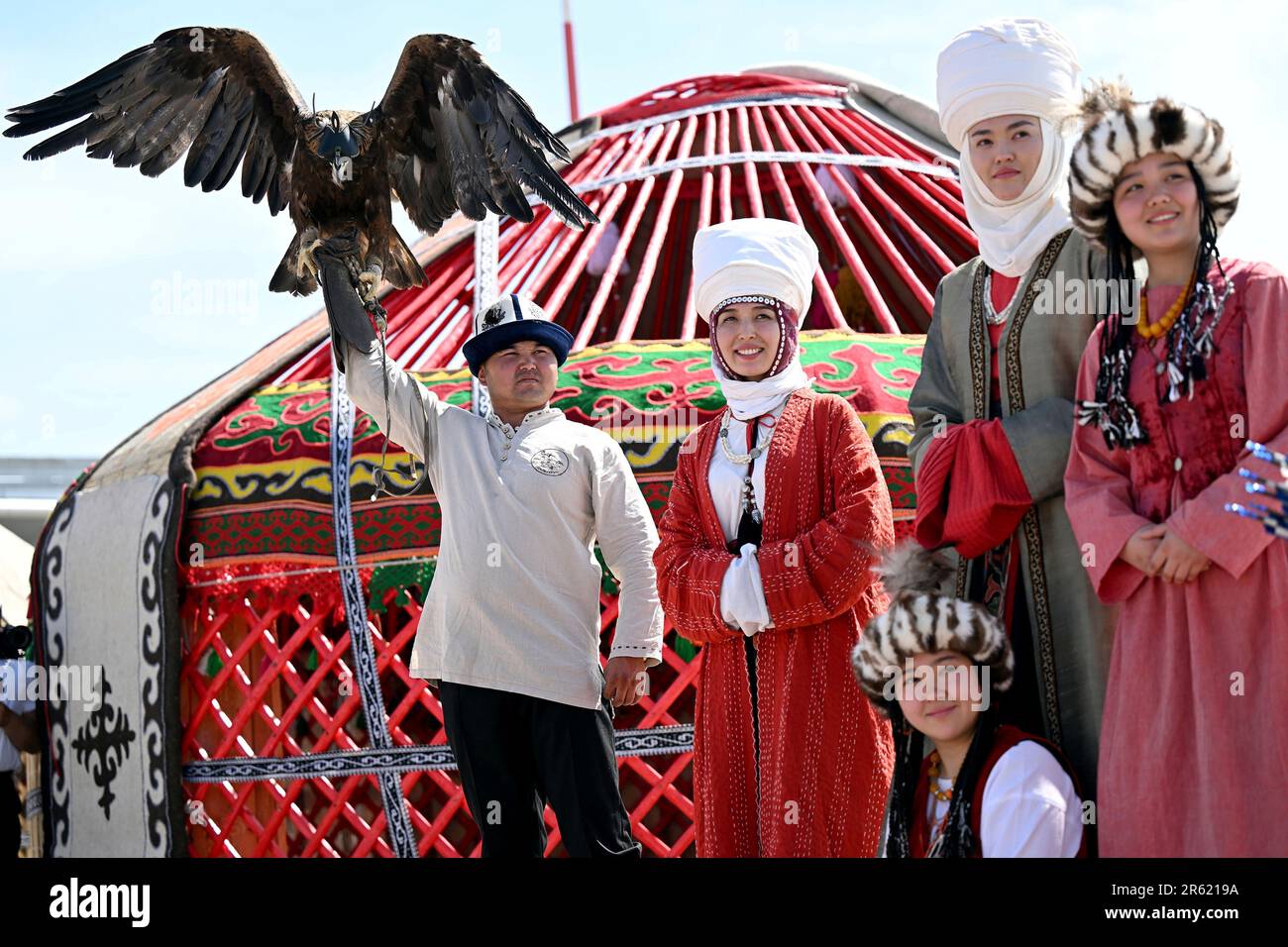 In this photo released by Kyrgyzstan Presidential Press Service, people