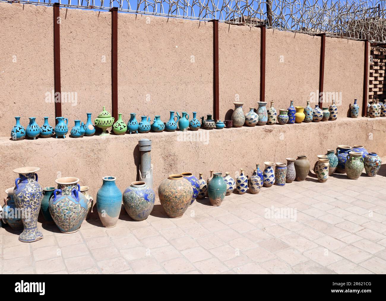 Traditional iranian souvenirs - colorful clay pots and jugs, Yazd, Iran Stock Photo