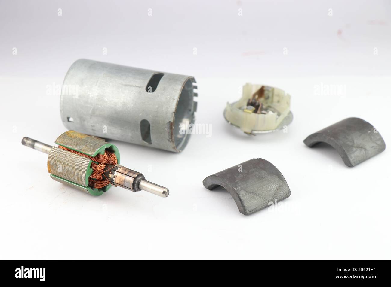 Disassembled electric motor with its rotor and carbon brushes