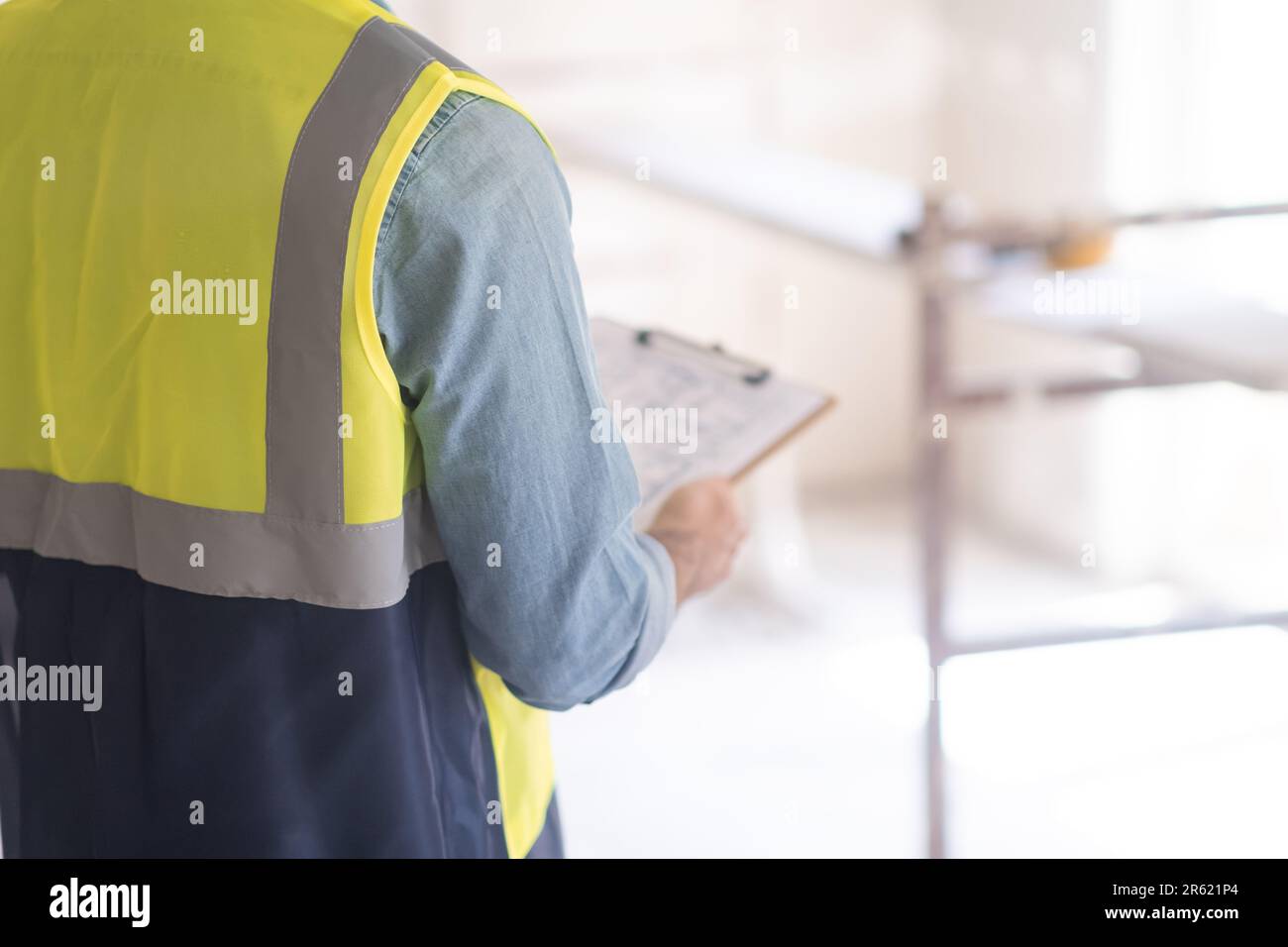 Checking Before Building Professional architect checking plan of office before starting ...