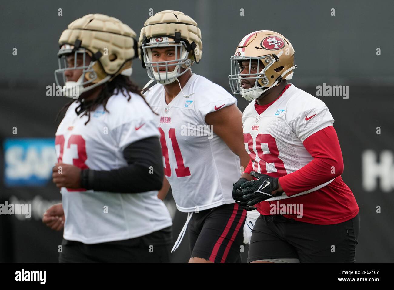 San Francisco 49ers defensive end Charles Omenihu poses with San