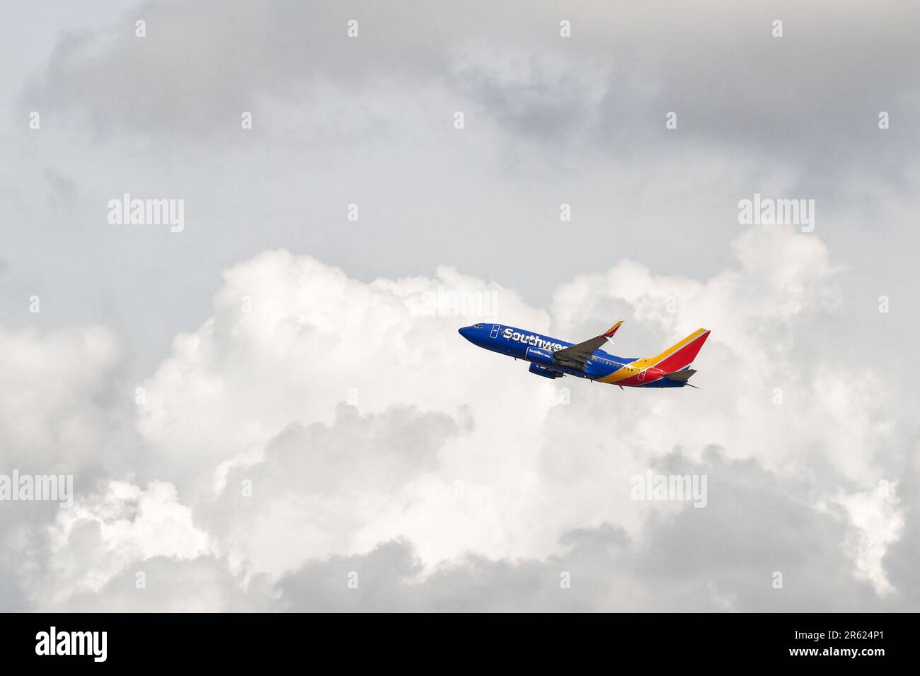 Phoenix, AZ - March 16, 2023: Southwest Airlines plane taking off  from Phoenix Sky Harbor International Airport into the clouds. Stock Photo