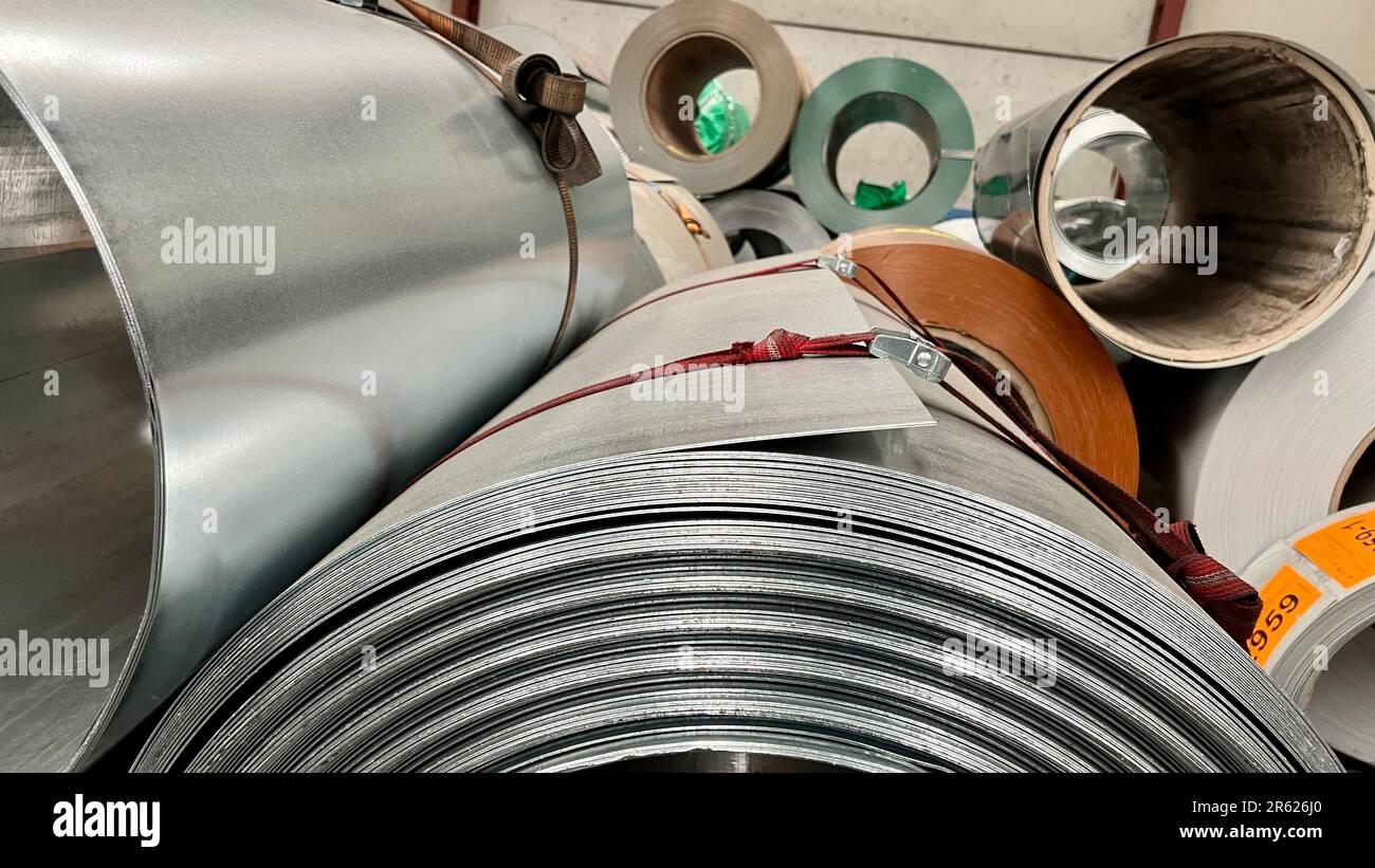A stack of steel rolls standing upright, ready to be used for various ...