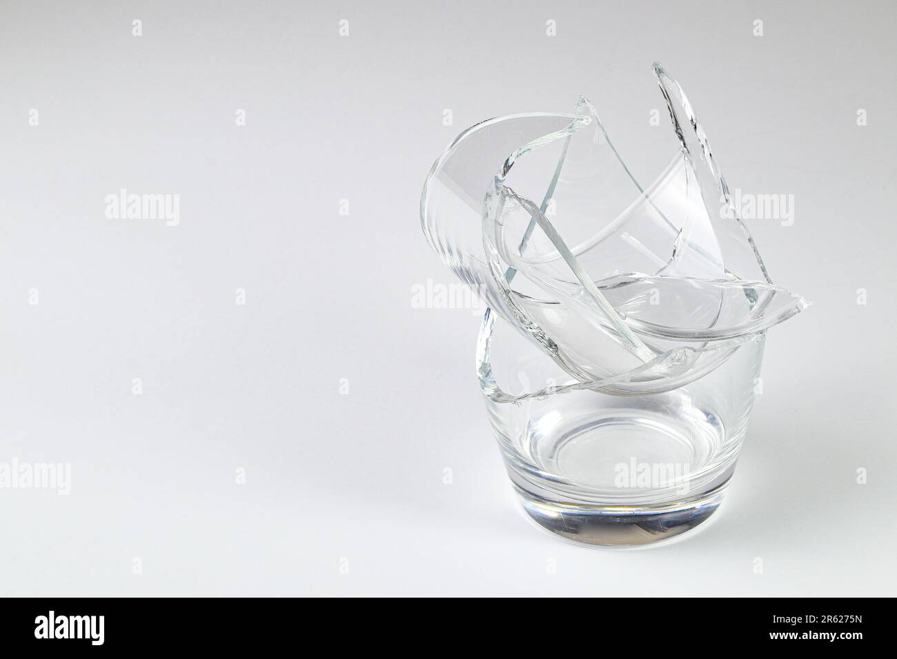 Parts of the broken cup jar glass isolated on white background
