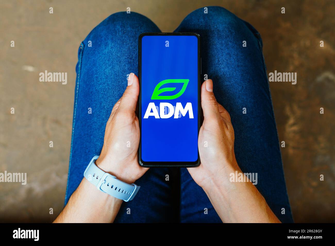 In this photo illustration, the Archer Daniels Midland Company (ADM) logo is displayed on a