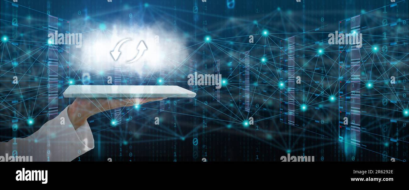Information technology concept. A man's hand uses a tablet to create, process, store, retrieve, exchange, and connect to data and digital information Stock Photo